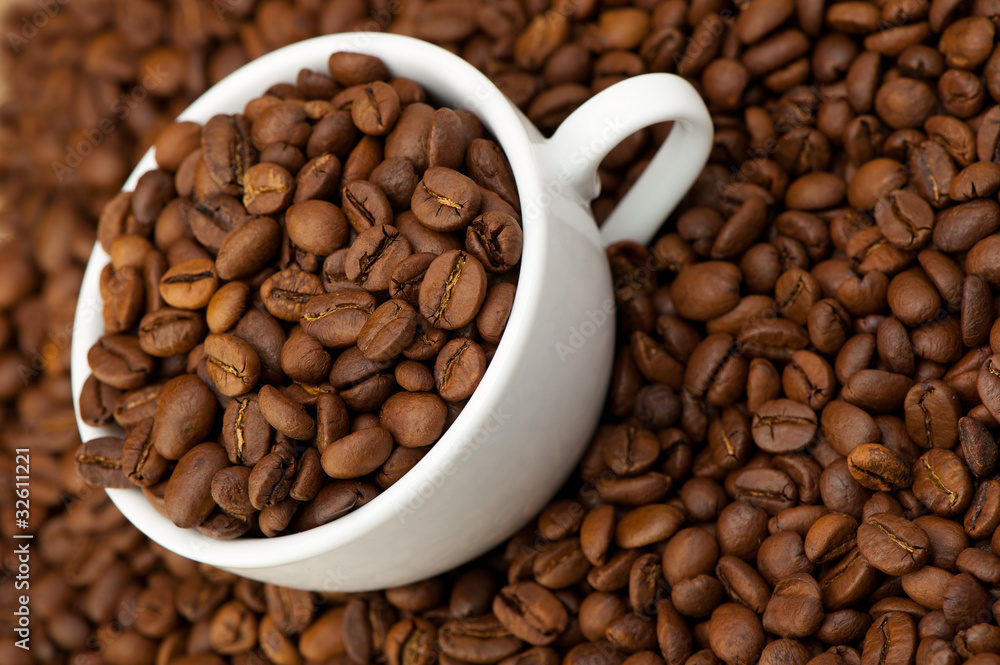 White cup with coffee grains White cup with coffee grains