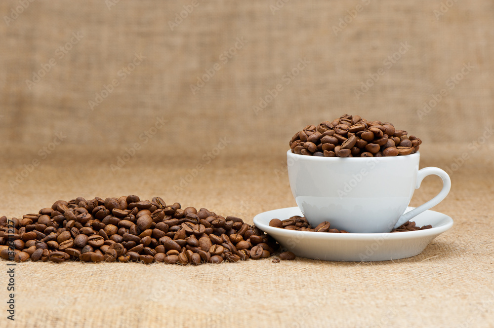 White cup with coffee grains White cup with coffee grains