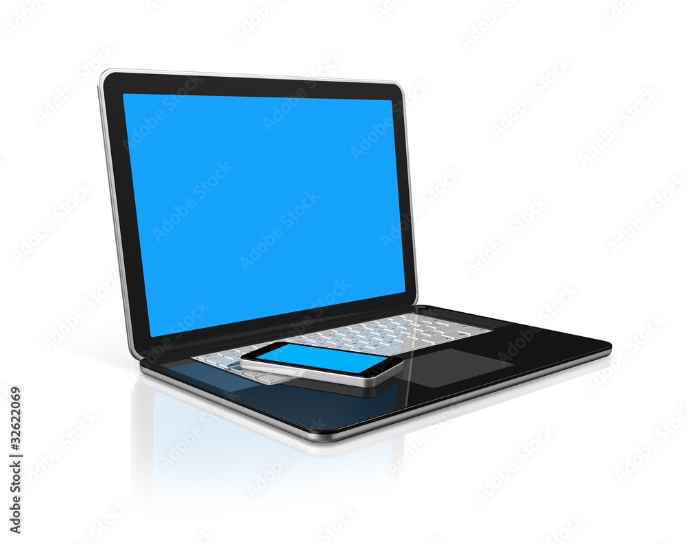 Mobile phone on a laptop Mobile phone on a laptop