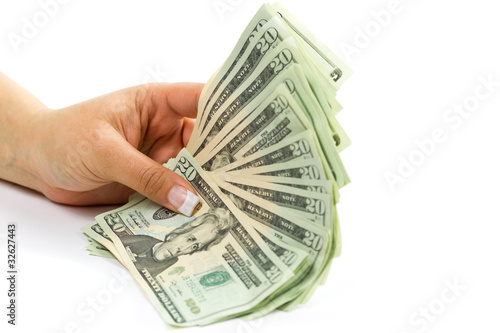 Female hands holding 20 dollar banknotes