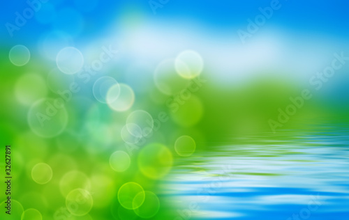 summer background with blurs and refelctions in water