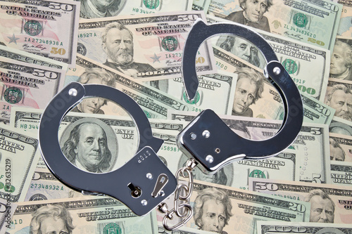 Dollar Currency notes with handcuffs photo