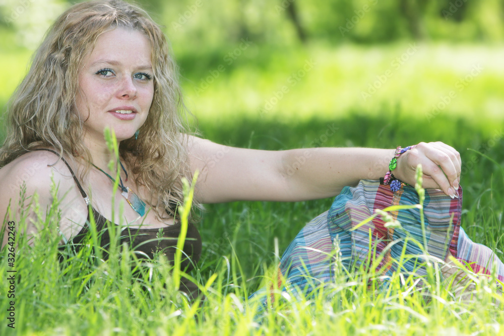 young woman relaxing on natural background young woman relaxing on natural background