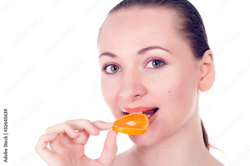 Happy pretty model posing with slice of juicy orange Happy pretty model posing with slice of juicy orange