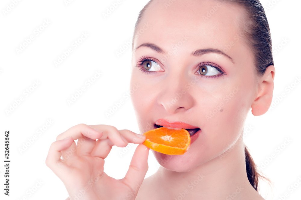 Happy pretty model posing with slice of juicy orange Happy pretty model posing with slice of juicy orange