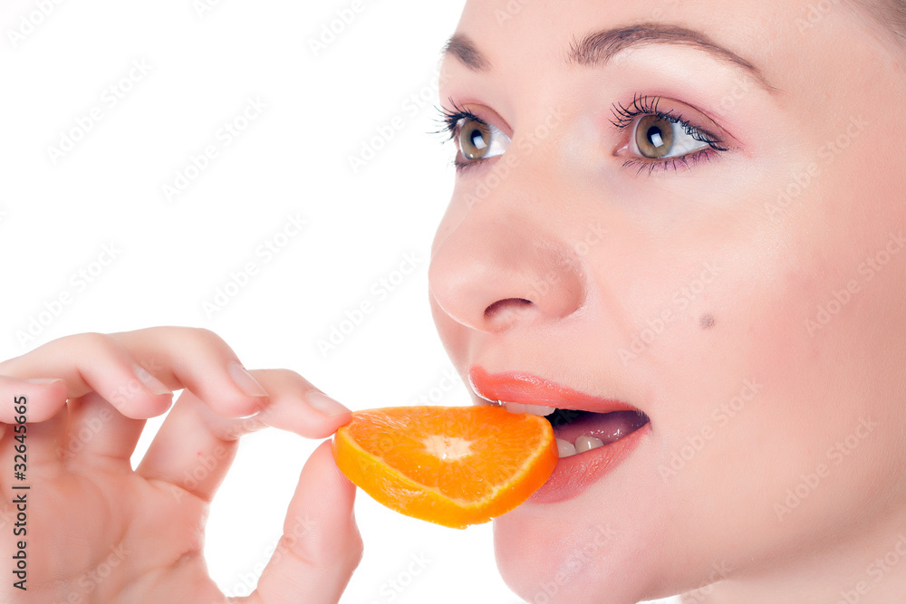 Happy pretty model posing with slice of juicy orange Happy pretty model posing with slice of juicy orange
