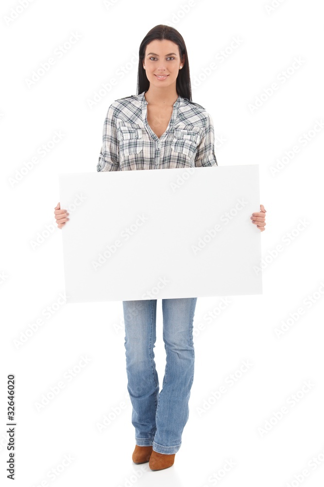 Attractive girl holding a white panel smiling Attractive girl holding a white panel smiling