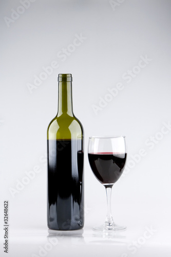 Glass of Red Wine with Bottle