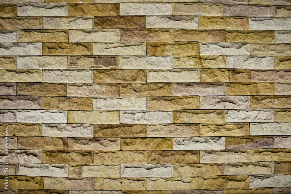 Obraz premium San stone brick wall.