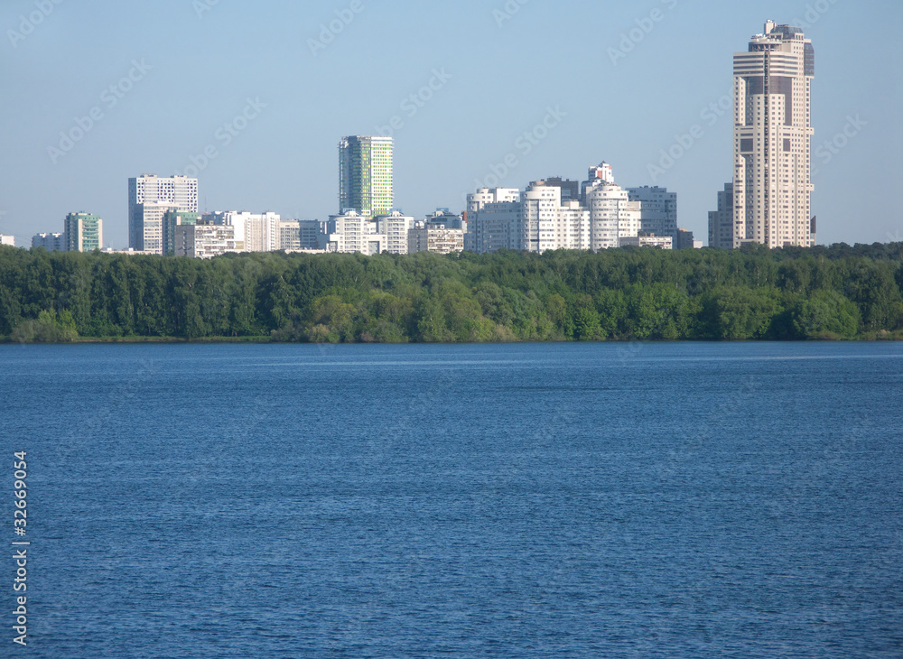 Many city buildings after river and forest Many city buildings after river and forest
