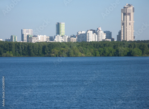 Many city buildings after river and forest