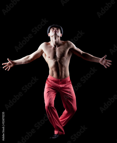 young naked man dance striptease in red costume