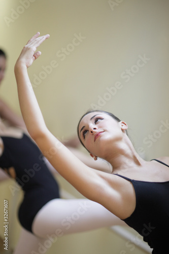 Ballerina practicing her routine in a studio photo