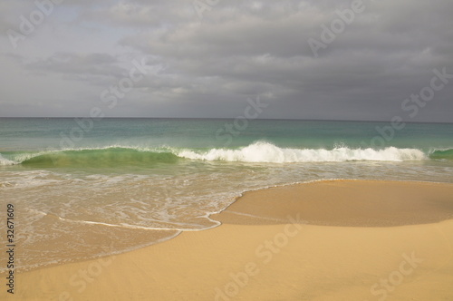 waves roll in on the beach paradise of boa vista