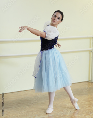 Ballerina dancing in a studio photo