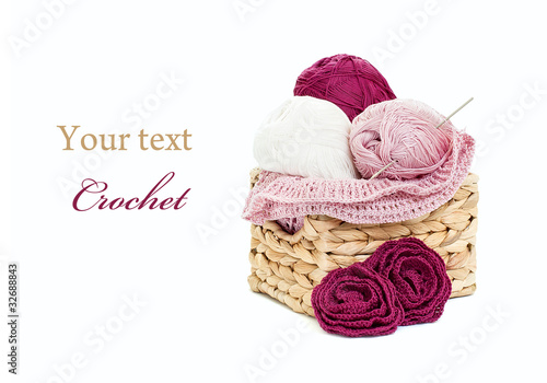 Crochet and skeins of yarn isolated on white background