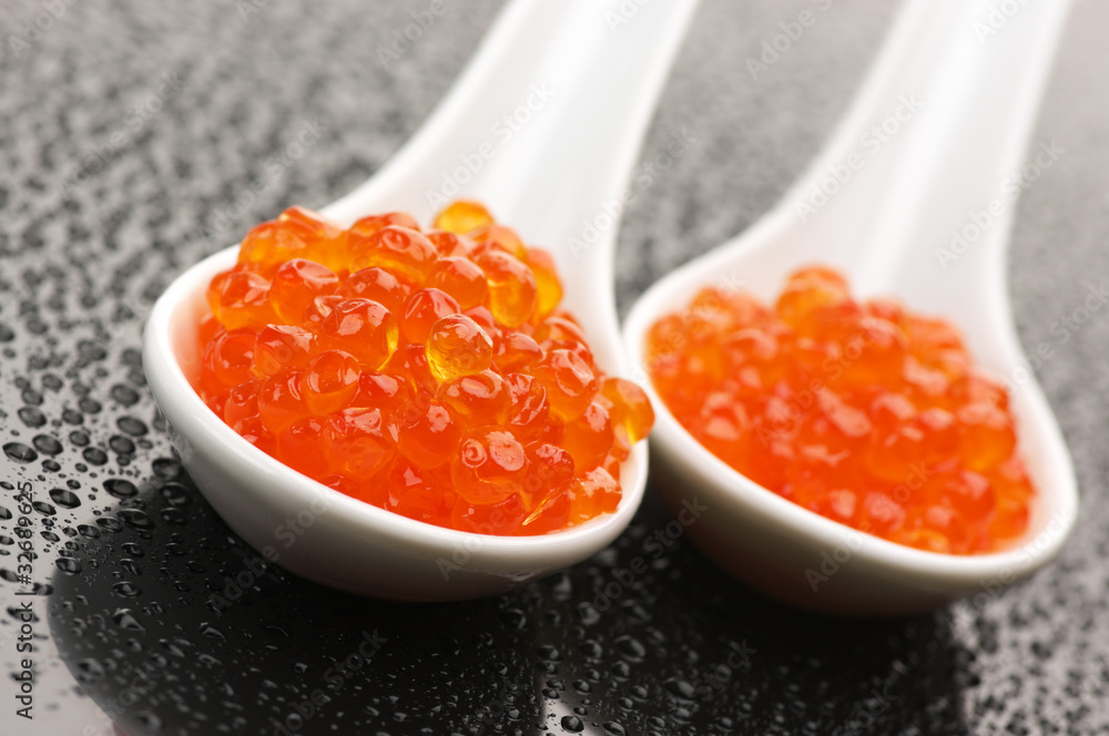 Salmon caviar in spoons