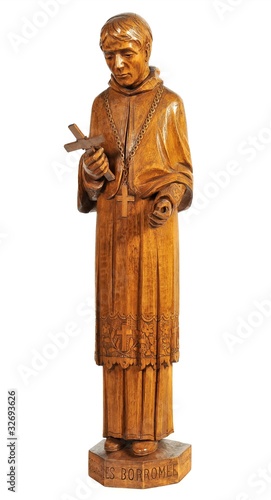 religious wood figurine of St Charles Borromée on white