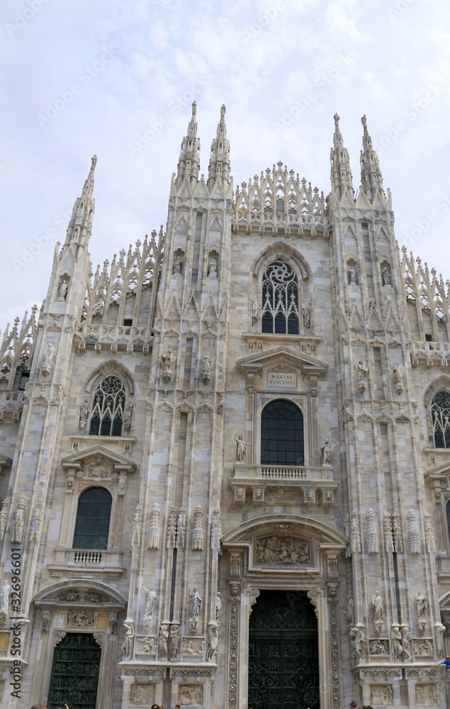 The Gothic facade of the Cathedral in Milan Italy