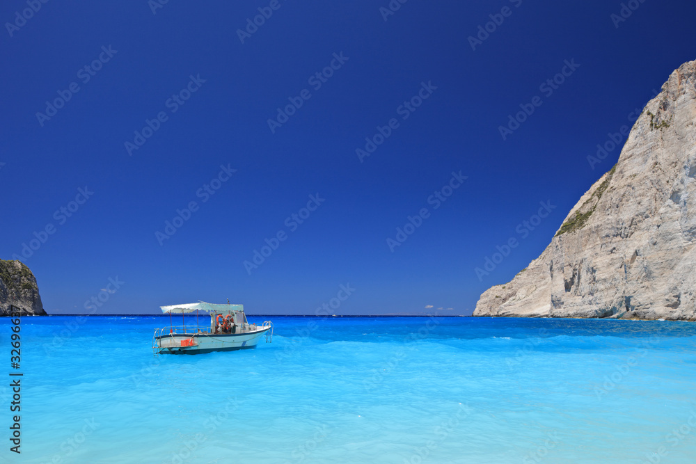 Boat anchored on Navagio beach, Zakynthos island, Greece