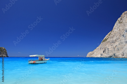 Boat anchored on Navagio beach, Zakynthos island, Greece
