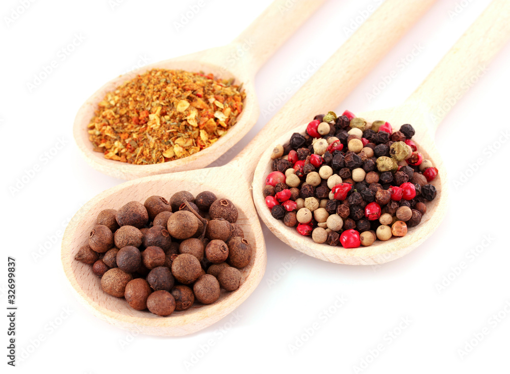 Spices in spoon isolated on white Spices in spoon isolated on white