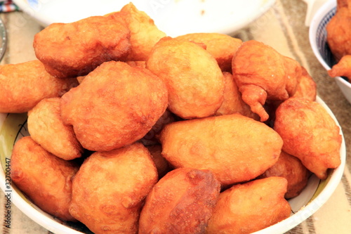 Sweets Typical bunuelos Puertomingalvo village street market Ter photo