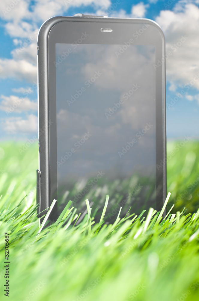Fototapeta premium phone in grass