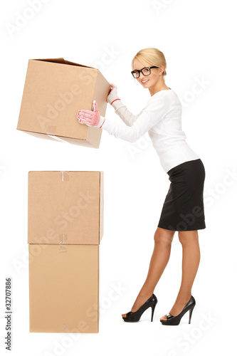 attractive businesswoman with big boxes © Syda Productions