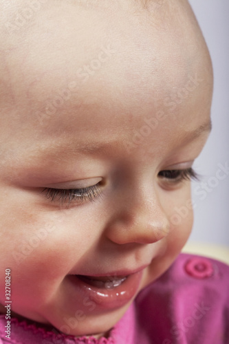 Closeup portrait of smiling baby girl