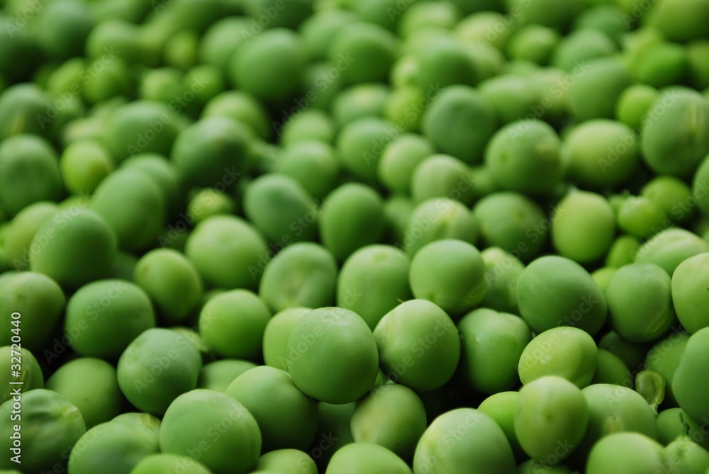 Shelled fresh ripe sweet green peas macro background Shelled fresh ripe sweet green peas macro background