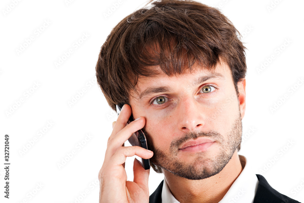 Young handsome businessman talking at the cell phone Young handsome businessman talking at the cell phone