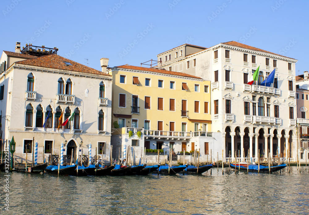 Several gondolas on grand canal in Venice in Italy