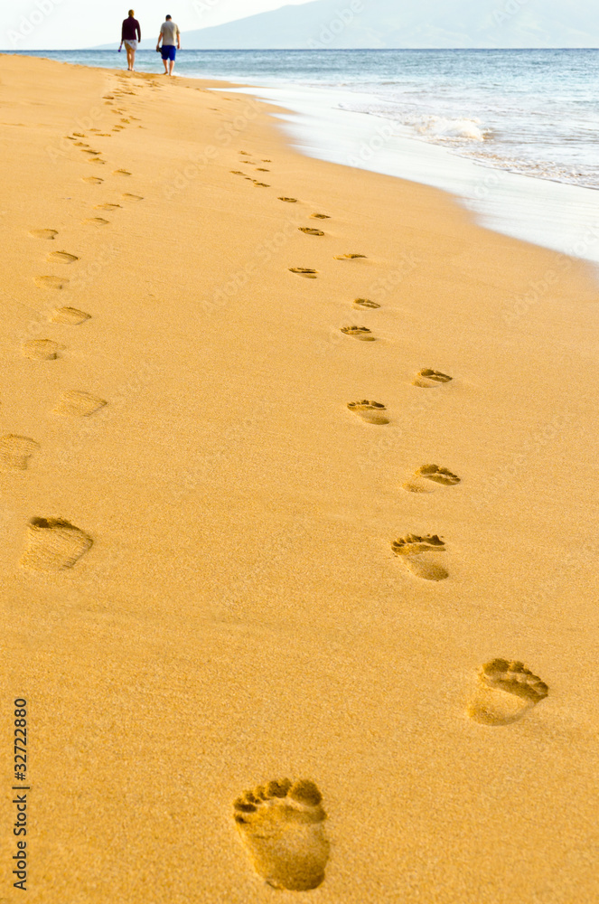 Human footprints leading away from the viewer Human footprints leading away from the viewer