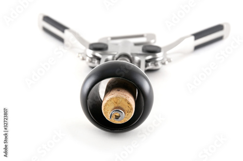 silver corkscrew with cork from wine isolated close up