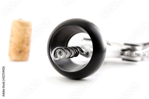 corkscrew with cork from wine isolated over white close up