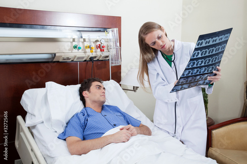 Doctor showing report to the patient