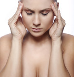 woman with headache on white background