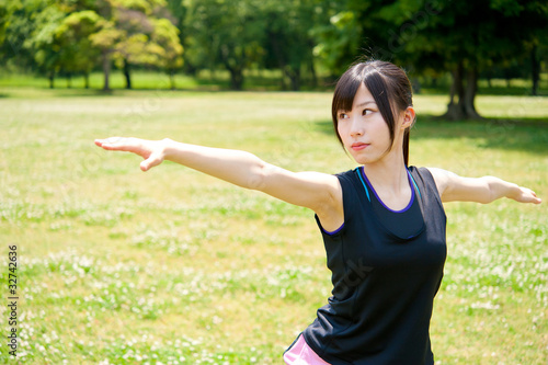 beautiful asian woman exercising in the park © taka