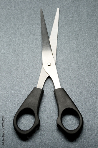 Scissors isolated on grey background