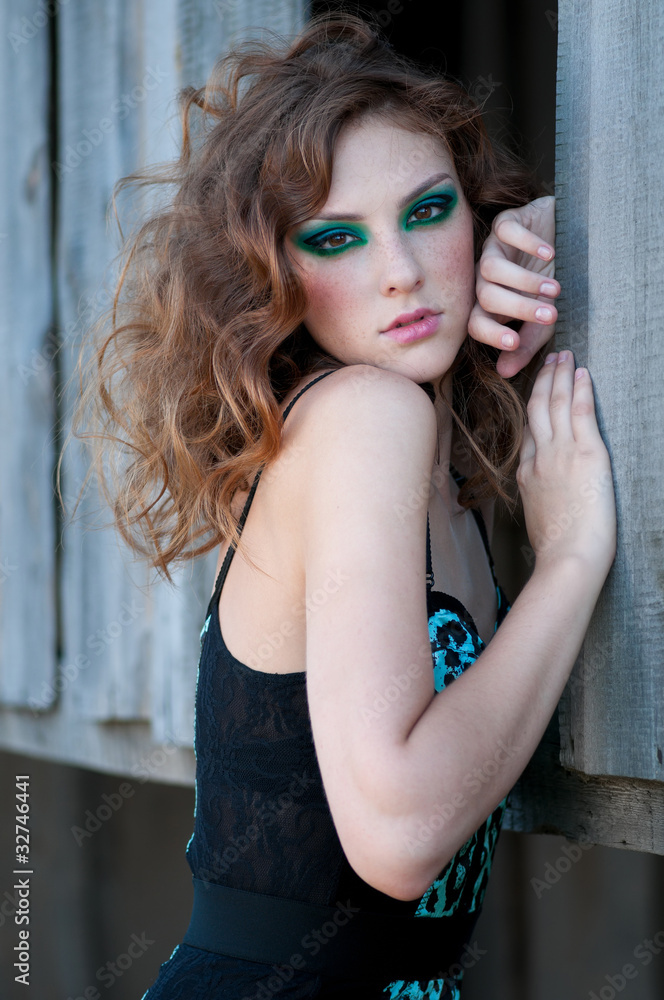 Fashion woman with green make-up at rural location Fashion woman with green make-up at rural location
