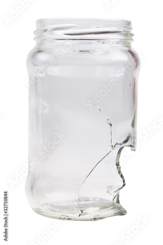 Empty broken glass jar isolated over white background.