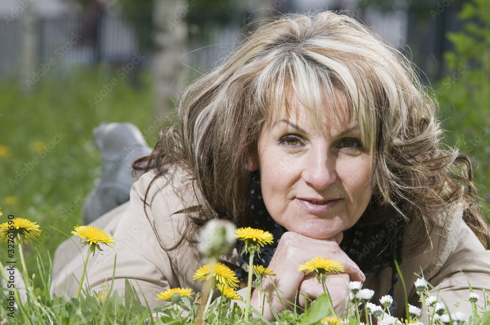 mature woman on the meadow near mature woman on the meadow near