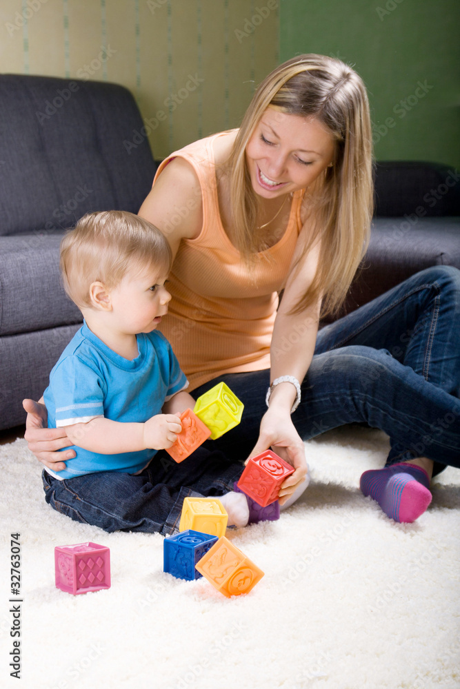 Young mother playing with baby boy Young mother playing with baby boy