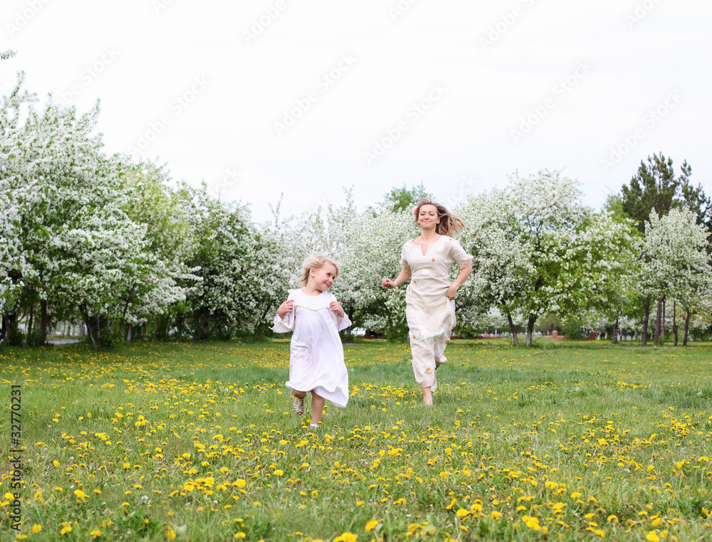 Naklejka premium girl with mother in the park
