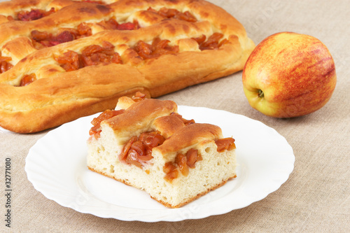 Homemade pie with apples and an apple