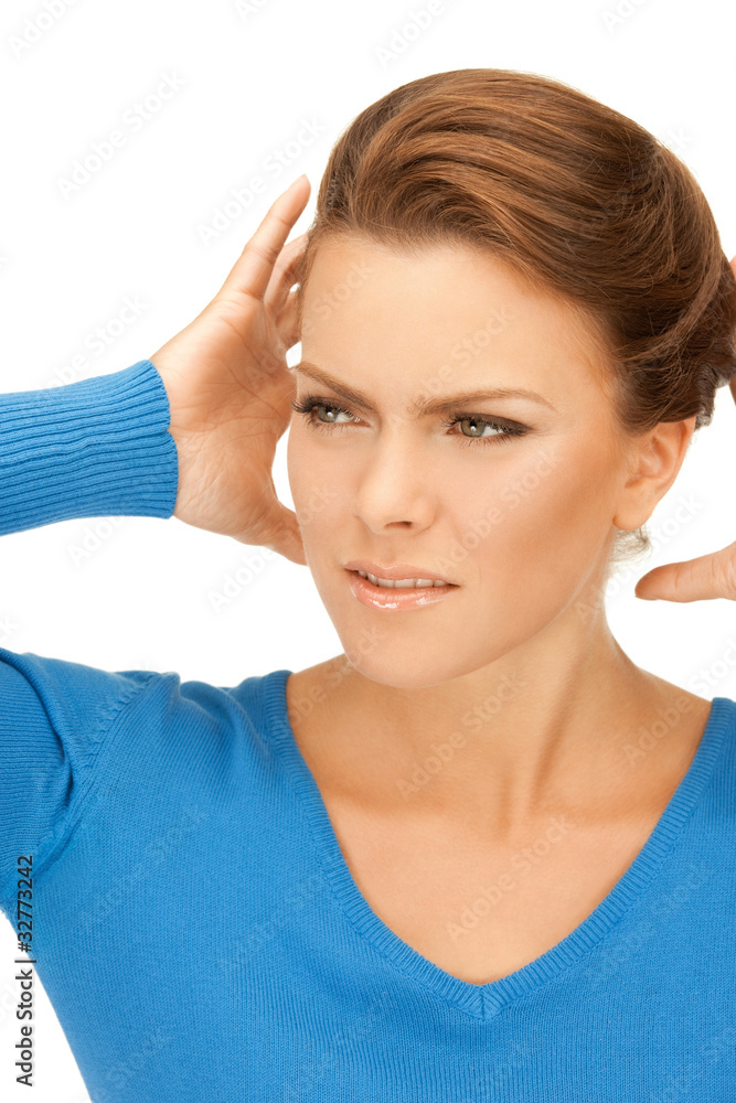 woman with hands on ears