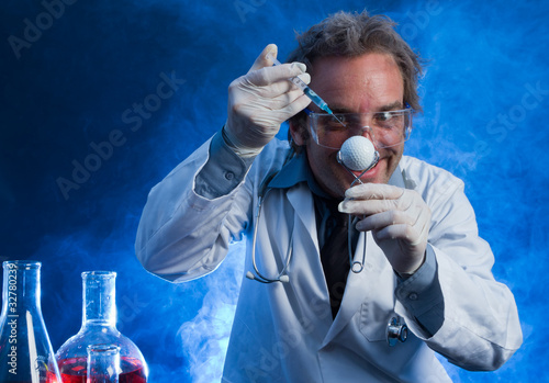 Mad Scientist with a Golf Ball and Hypodermic Needle