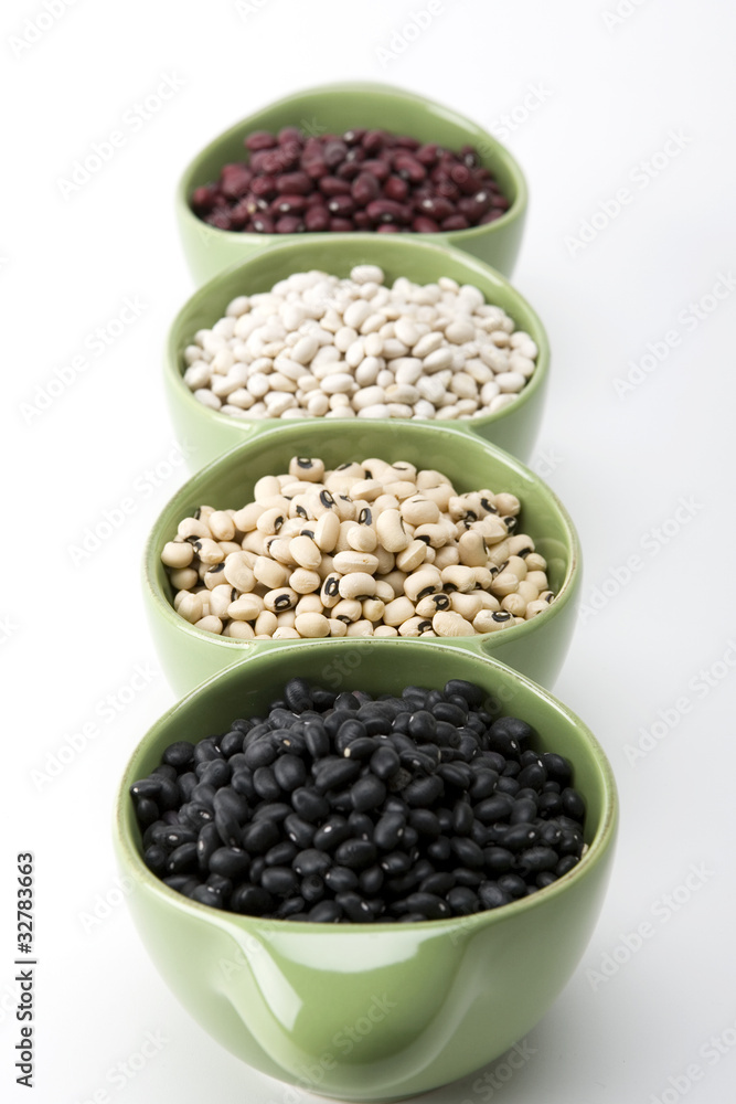 Assorted mixed dried beans in green ceramic dish Assorted mixed dried beans in green ceramic dish
