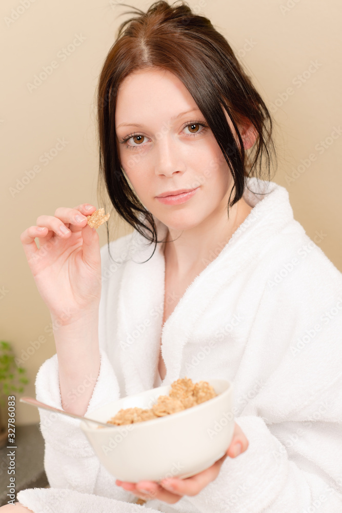 Young student girl eat cereal for breakfast